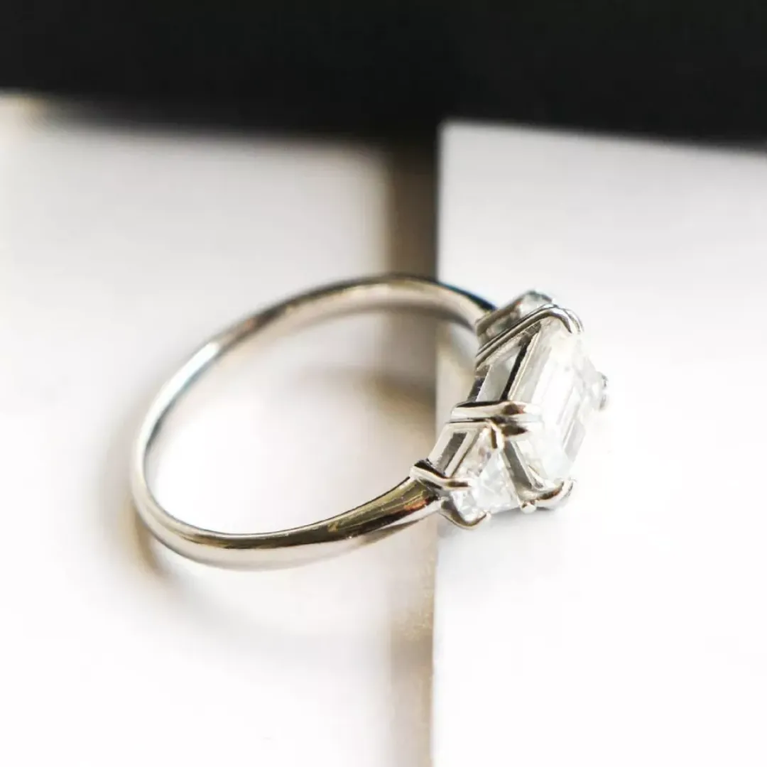 /public/photos/live/3 Stone East West Emerald Moissanite Trapezoid Ring 595 (2).webp